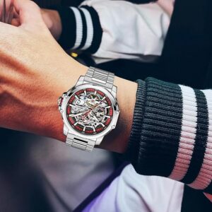 Silver and Red Openwork Watch — view 1